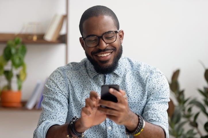 businessman using phone mobile apps at workplace